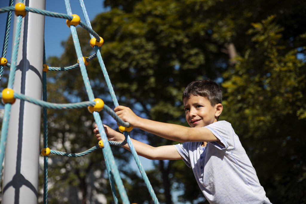 Young boy having fun in playground -Cyboard School