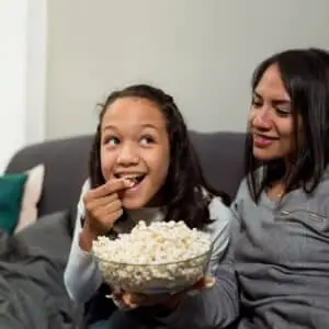 Mother and daughter enjoy movies night-Mother’s Day activities for kids