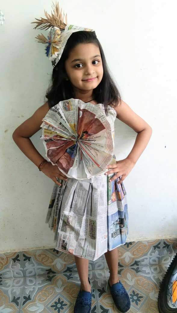 Cyboard student is ready in newspaper dress for a activity