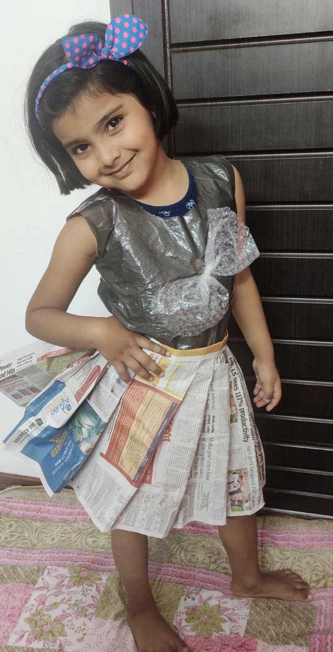 Cyboard student is ready in newspaper dress for a activity