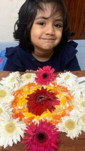 Student of Cyboard School is preparing a rangoli with flowers