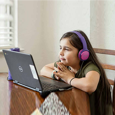 A girl using laptop - Kid friendly technology - Modern Education