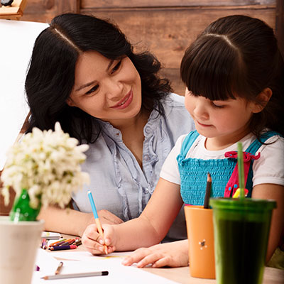 Adults and children reading together, sharing opinions and feelings from a story that builds empathy