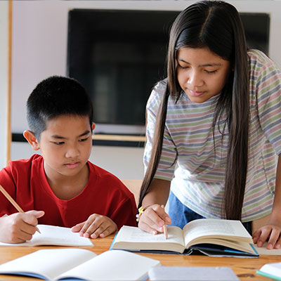 Children collaborating in an activity that builds empathy, understanding, and emotional intelligence through shared stories.