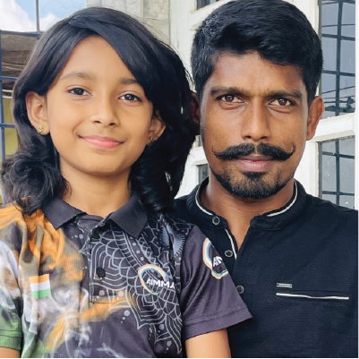 Student smiling with her father sharing positive online school experience