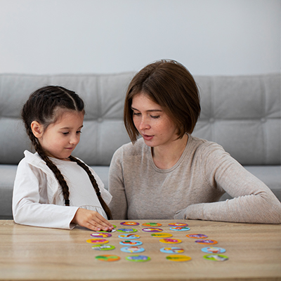 Family playing educational games for kids that build thinking and communication skills